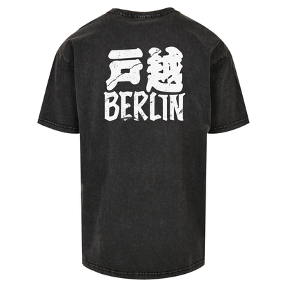 JSF Togoshi x Berlin Tee mockup in black acid wash featuring bold Togoshi Berlin back print.